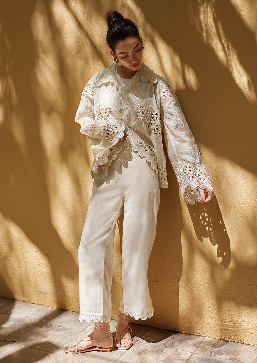 Nainpreet Edit '25 Ayla: ivory organza shirt with cutwork, embroidery, and pearls. Model highlights bell sleeves, a captivating Indian festive outfit.